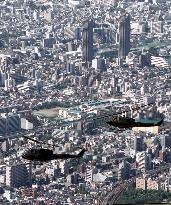 Air defense choppers hover over Tokyo skyscrapers